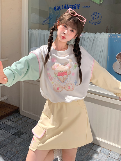 グリーンテディベアプリントドローストリングスウェットシャツ裾イエローデザインカラーブロック秋と