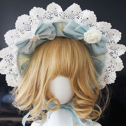 ピンク/ブルーの花柄リボンディテール、レーストリムのボンネット