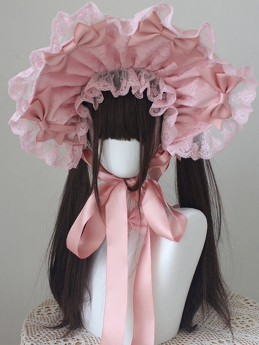 ピンクの蝶結びディテール、レーストリムのボンネット