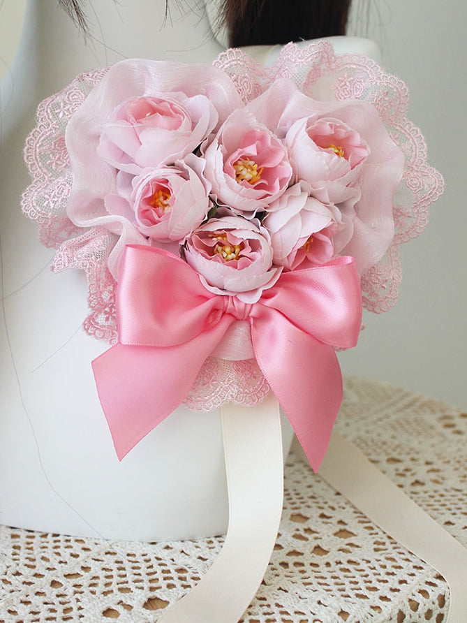 Rosa Haarspange mit floraler Schleife und Spitzenbesatz
