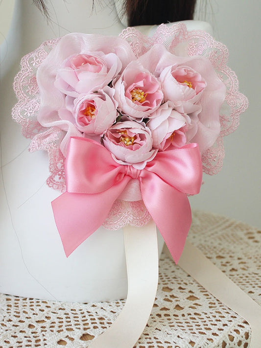 Rosa Haarspange mit floraler Schleife und Spitzenbesatz