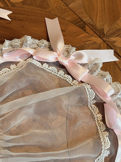 Verzierte blaue Auflage / Schleifenband rosa