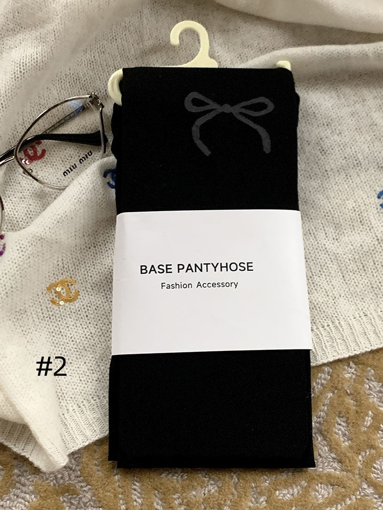 蝶結び柄タイツ