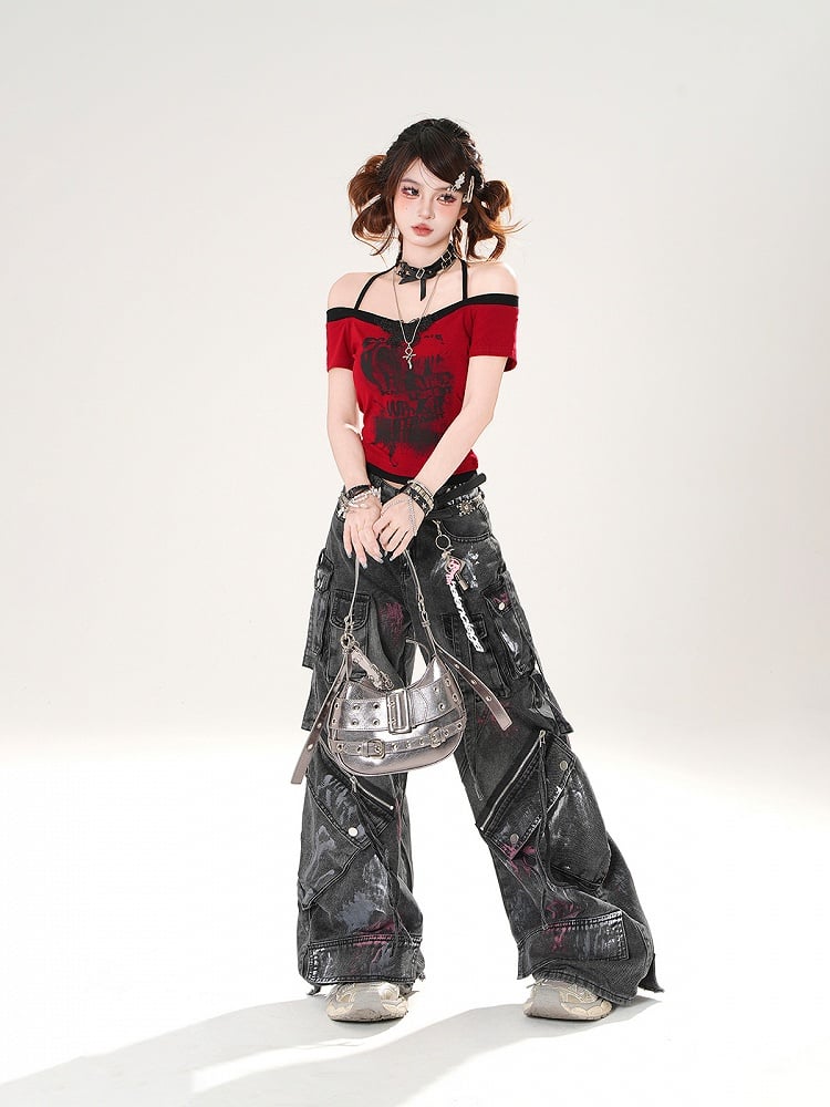 Schwarze Jeans mit weitem Bein und Used-Look, Reißverschlussdetails, niedriger Sprühfarbendruck