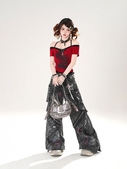 Schwarze Jeans mit weitem Bein und Used-Look, Reißverschlussdetails, niedriger Sprühfarbendruck