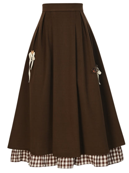 ブラウンの蝶結びディテール、足首丈スカート、チェック柄、フリル裾