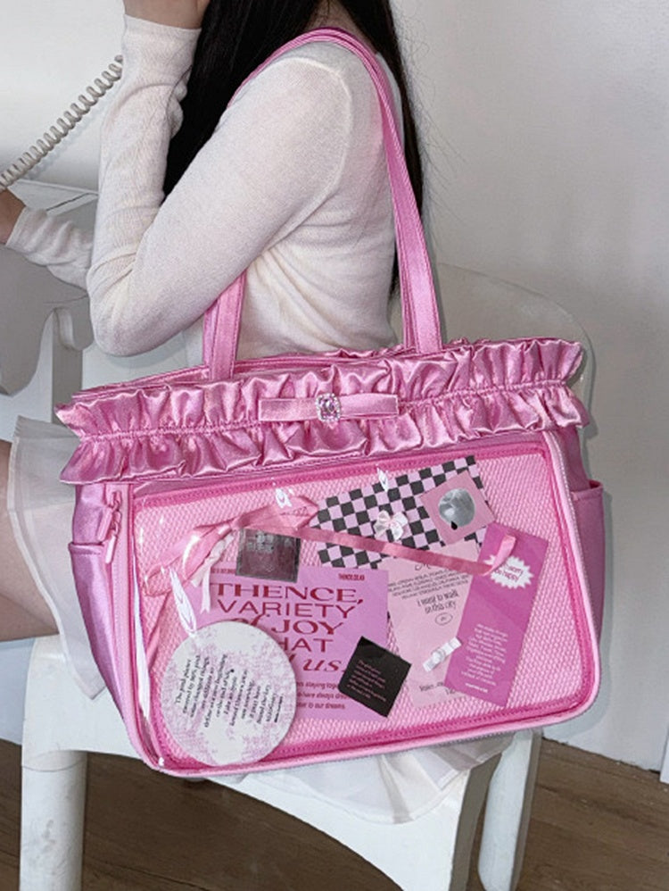 Rosarote Ita-Tragetasche mit Rüschenbesatz und Strass-Schleife