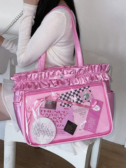 Rosarote Ita-Tragetasche mit Rüschenbesatz und Strass-Schleife