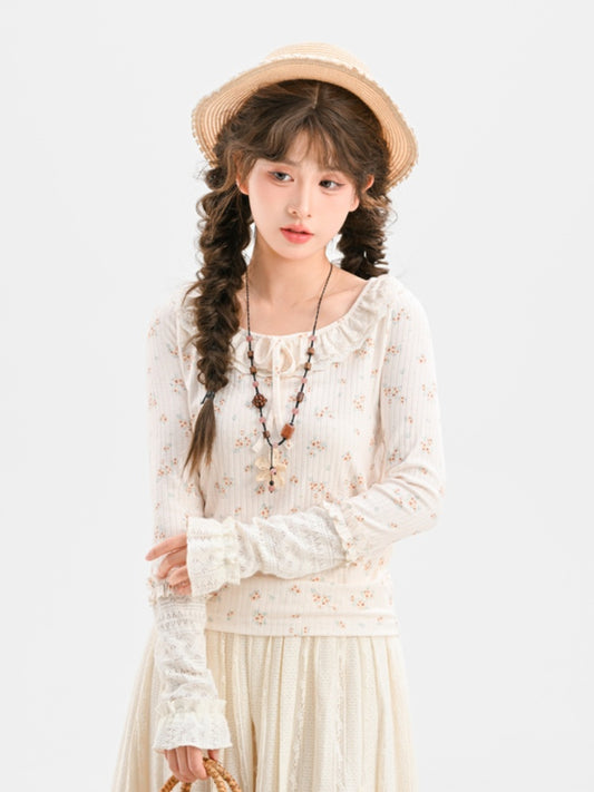 Beiges, schmal geschnittenes Top mit Blumenmuster und Schleife zum Selbstbinden mit Spitzenkragen