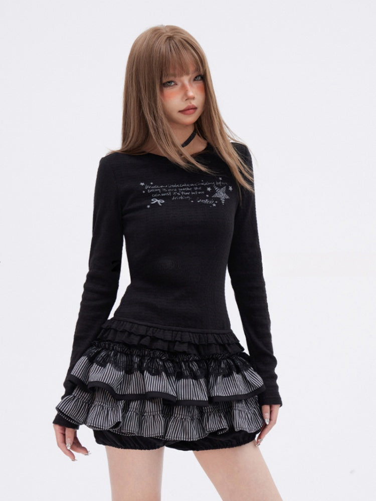 Schwarzes, eng anliegendes, bedrucktes Top mit Rundhalsausschnitt, gestuftem Rüschenbesatz