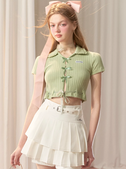 Faltenrock mit hohem Bund und kurzem Logo