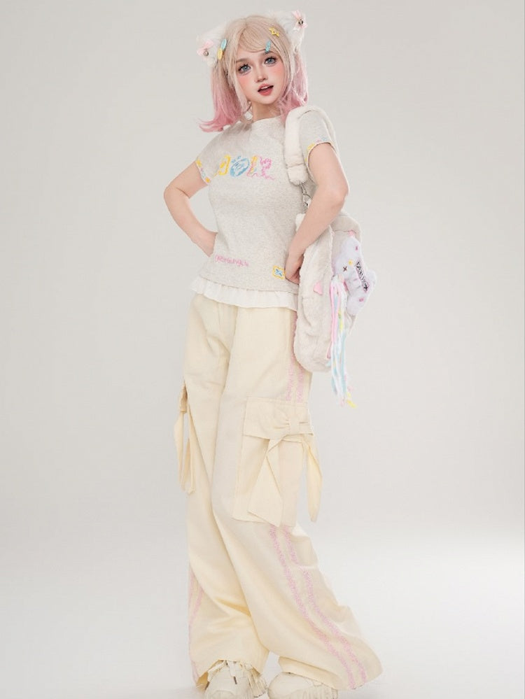 Hose mit floralen Schleifendetails und geradem Bein mit apricot/schwarzen Streifen und