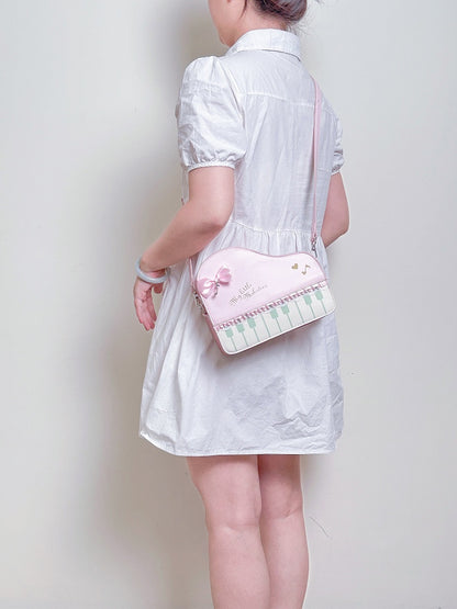 Pink Crossbody Bag With Piano Key Design And Bow Accent Chic