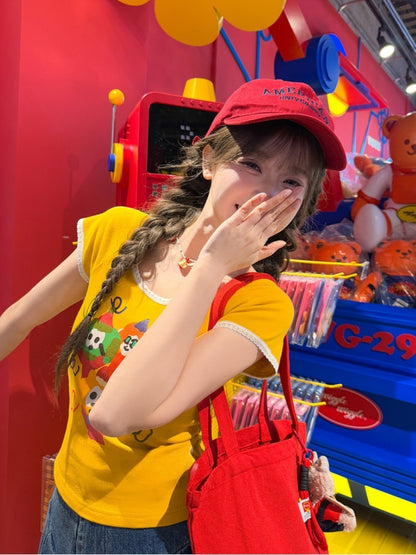 漫画プリントTシャツ ネックジンジャーレーストリムラウンド