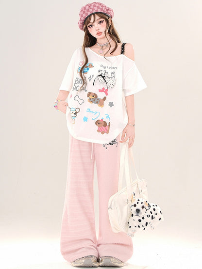 Weiß/Schwarzes lockeres T-Shirt mit asymmetrischem Ausschnitt und Cartoon-Welpen