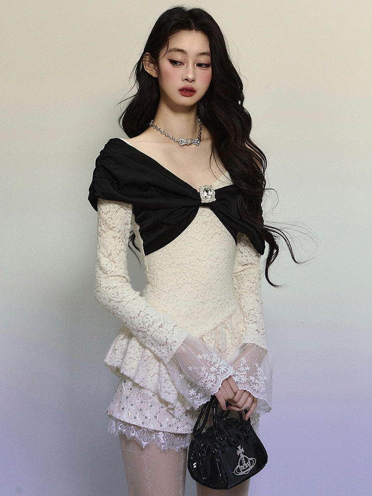 Aprikosenfarbenes Spitzentop mit großer Schleife, asymmetrischem Saum, V-Ausschnitt und langen Ärmeln