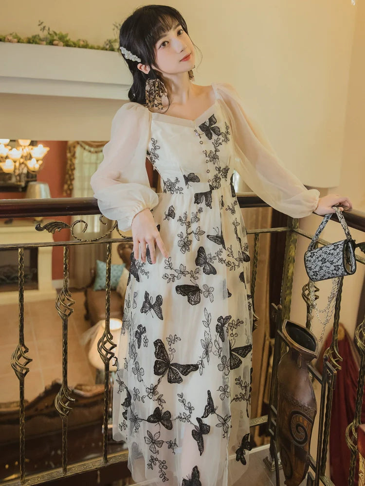 Transparentes Schmetterlings-Chic-Kleid Retro