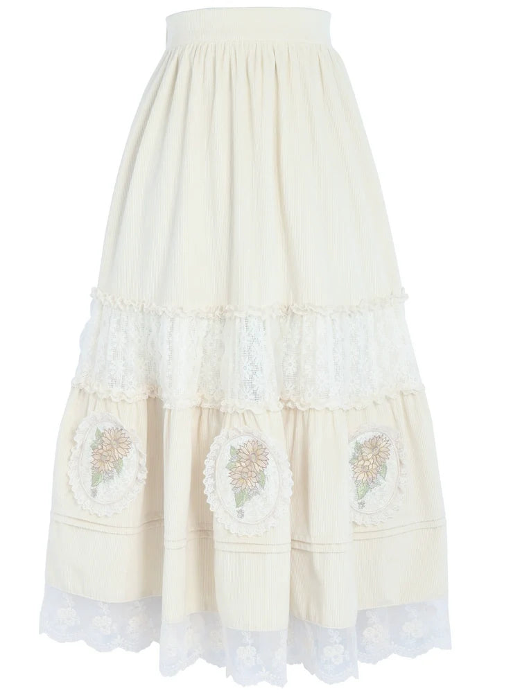 Langer Rock aus Cord mit Blumen- und Waldstickerei