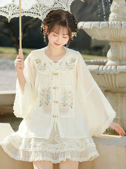 Rüschenhemd, angesetzter Rock mit chinesischem Kragen + transparenter Waldstoff