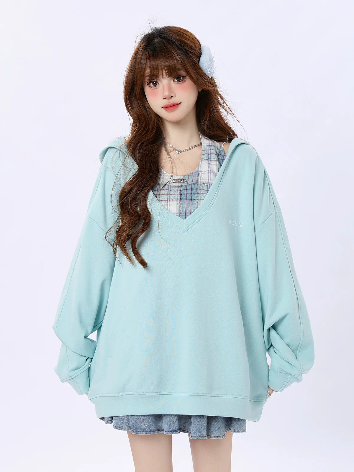 Kariertes Oberteil mit zwei lockeren Kapuzenstücken