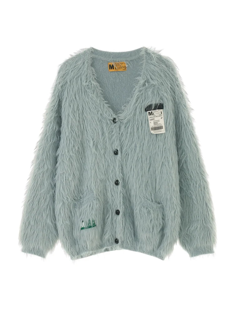 Blaue, zottelige graue Strickjacke