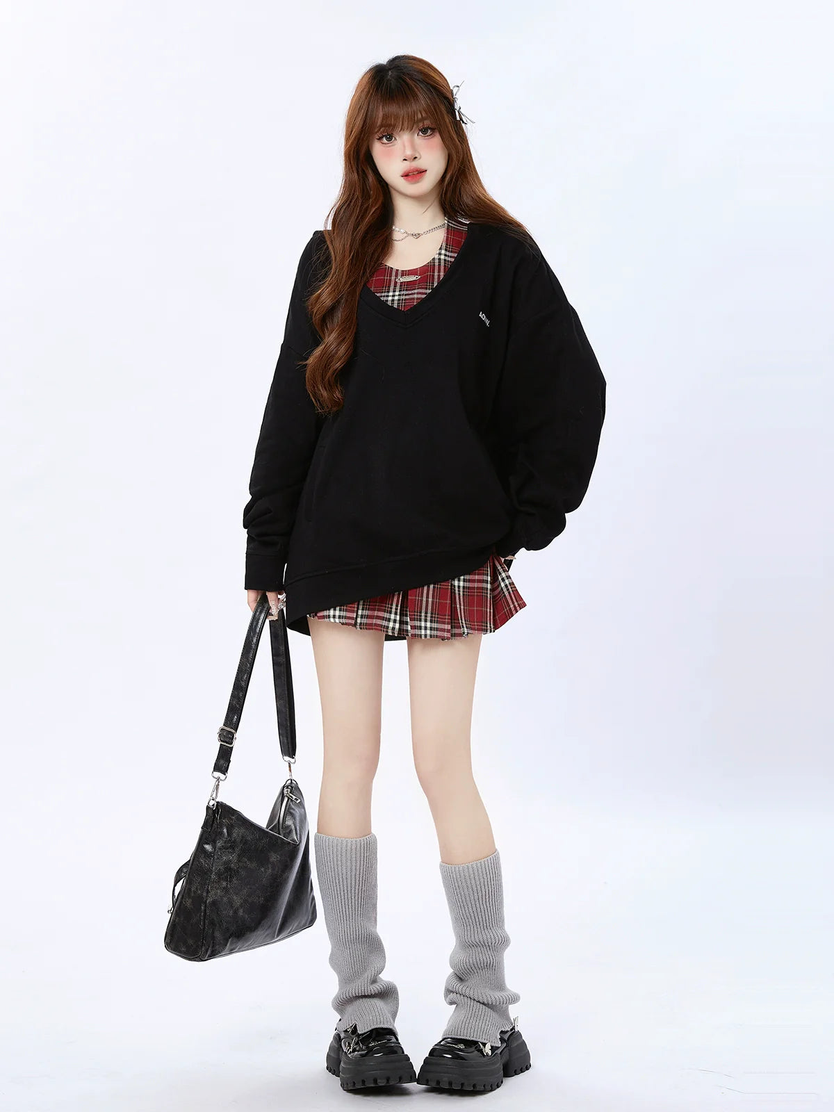 Kariertes Oberteil mit zwei lockeren Kapuzenstücken