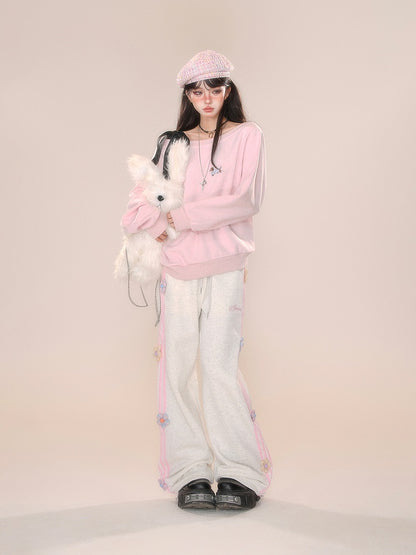 Design Hose mit geradem Bein und Blumenmuster in Grau/Rosa