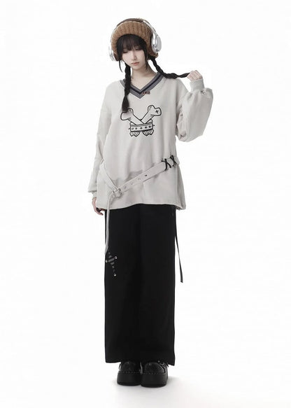 Schwarze Hose mit Schnallenriemen und Stern-Applikation