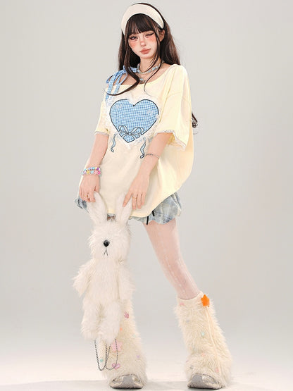 ミルクイエロー/ピンク チェック柄 ハートプリント アシンメトリーネックライン レーストリム Tシャツ