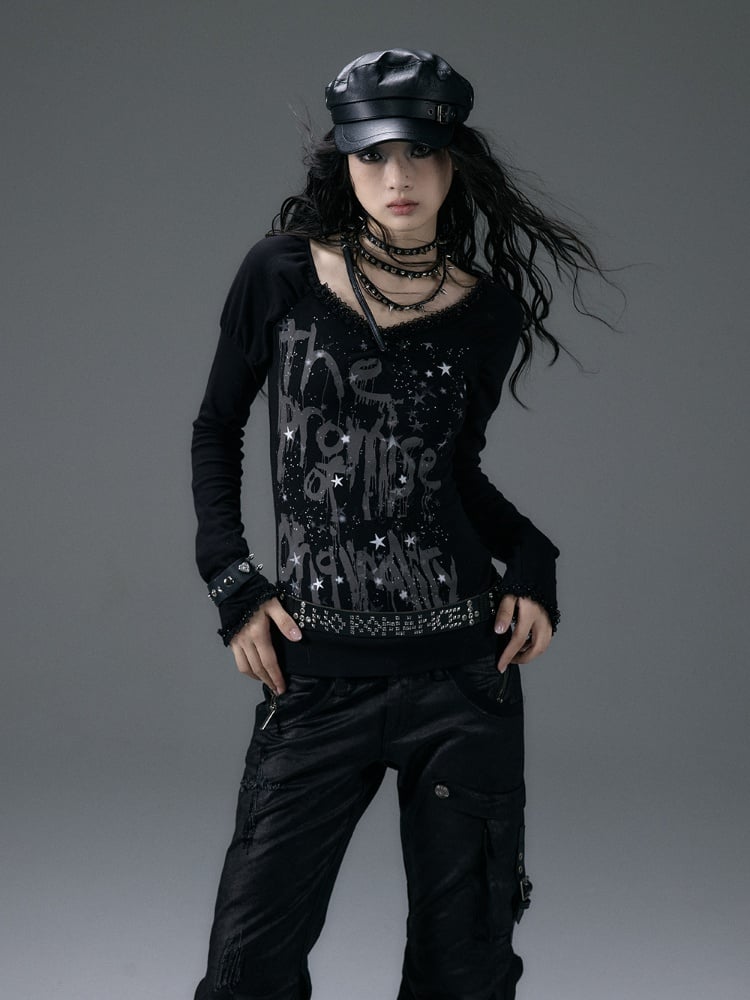 Schwarzes Top mit V-Ausschnitt und schimmernder Sternspitze