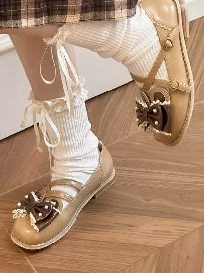 耳の上部に茶色の十字形装飾のビーズリボンのウサギのデザイン