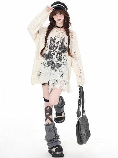 Aprikose/Schwarzes lockeres Strickoberteil mit Schmetterlingsmuster und Löchern im Used-Look und V-Ausschnitt