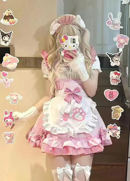 Person wearing a pink and white outfit with cartoon character stickers on a pink background