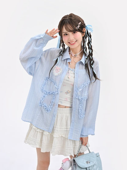 セミシースルーのフリル付き蝶結びアップリケ付きブルーサンプロテクションシャツ
