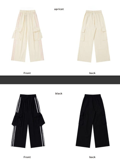 Hose mit floralen Schleifendetails und geradem Bein mit apricot/schwarzen Streifen und