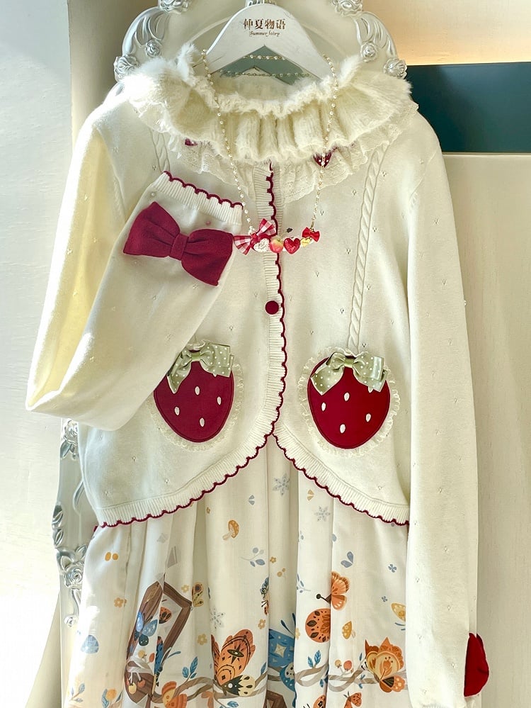 ホワイトの長袖ストロベリーアップリケカーディガン