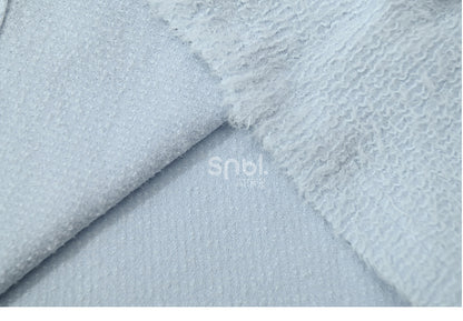 Blaues, langärmliges Oberteil mit Plüschbesatz am Ausschnitt und Schleifendetails