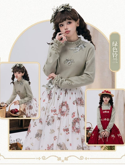 秋らしいレースアップのカフスニットのリリーバレーグリーンの刺繍トップス