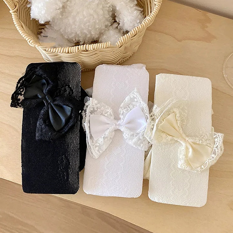 ブラック/ホワイト クリーミーホワイト リボン飾り 蝶結びとハートの網タイツ