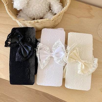 ブラック/ホワイト クリーミーホワイト リボン飾り 蝶結びとハートの網タイツ