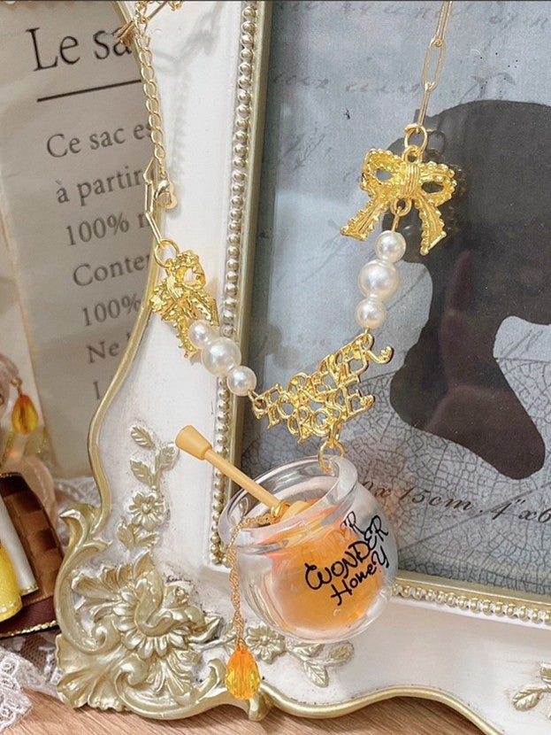 Gelb verzierter Perlen-Honigtopf-Anhänger und Halskette mit Schleife