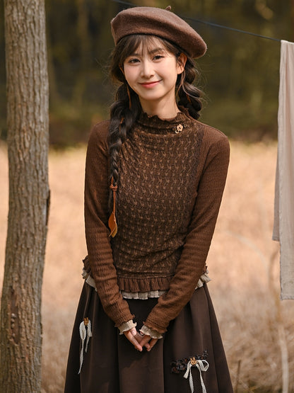 Braunes Oberteil mit Rüschenausschnitt und langen Ärmeln und Rüschensaum