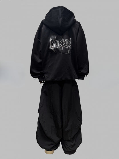 Schwarze Jacke mit Zweiwege-Knopfleiste und Reißverschluss