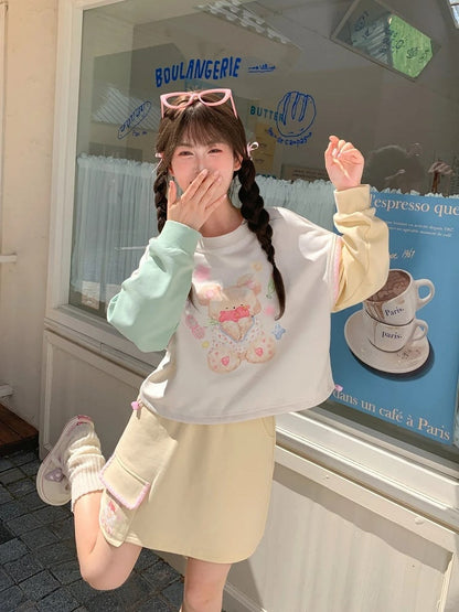 グリーンテディベアプリントドローストリングスウェットシャツ裾イエローデザインカラーブロック秋と