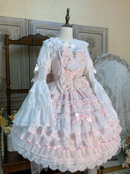 ピンクの花嫁の蝶結びで飾られたレイヤードスカートの甘い姫ロリータジャンパースカートセット