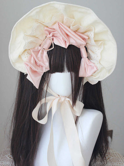 ピンク/ブルーのビーズ付き蝶結びディテール、レーストリムのボンネット