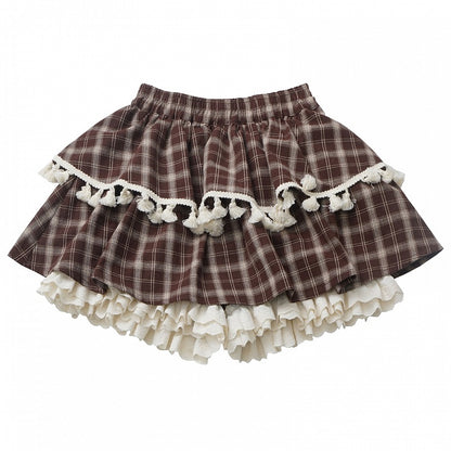 ブラウンのチェック柄ティアードスコート、フリル袖口、フリンジトリム