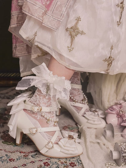 デザイン：ハートにクロスビーズ、トップチャーム、ホワイトリボン