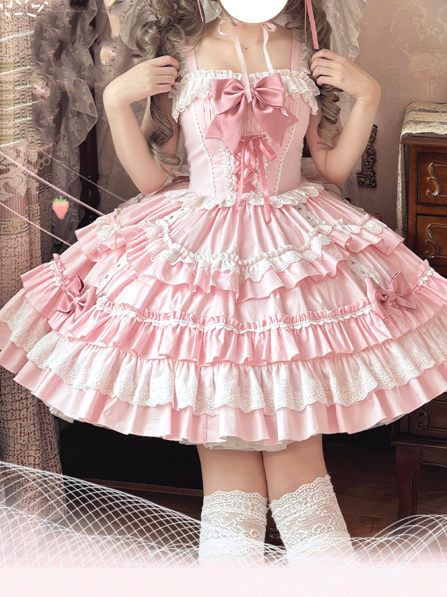 Front view of pink tiered Lolita dress with square neckline and bow