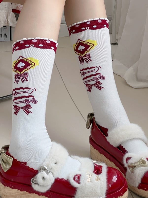 Weiße Lolita-Wadensocken mit Schleifenmuster und Rüschenbündchen